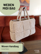 Beige crochet woven handbag on stand in front of blurred orange couch